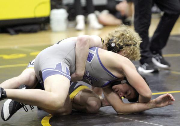 Tecumseh’s Nick White, in the 150 weight class, flips his Little Axe opponent for the pin during the Dec. 3 home dual.