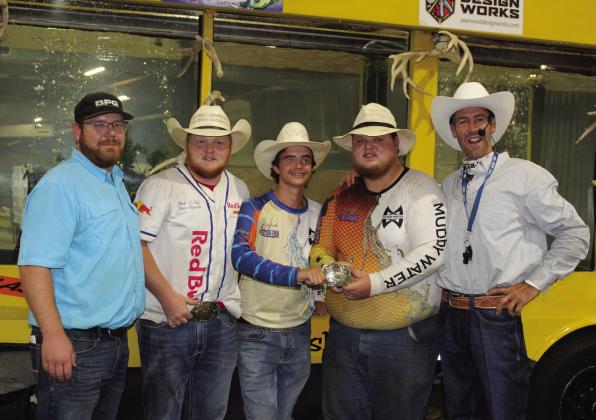 Amadeus Sandifer and Jacob Vincent, with belt buckle, tied for first place in the Pottawatomie County Free Fair Big Bass Contest. Both of their fish weighed 5.7 pounds each. There was also a tie for second place between Grayson Jones and Cruz Winn, who both caught 2.12-pound bass. The first-place winners will receive $220 and a belt buckle, and the second-place winners get $110 each. Also shown, from left, are Trent Boles, Josh Vincent, Sandifer, Vincent, &amp; Fetch-n-Fish tank owner Jason Reynolds.