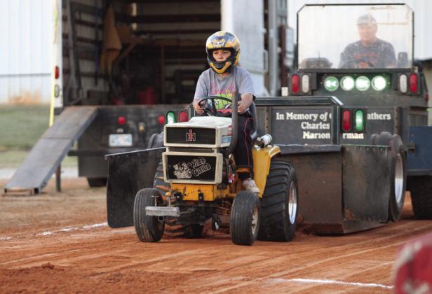 Madelyn Carter, of Meeker, pulls with the garden tractor, "Wild Child," in the Junior Modified division of the Pottawatomie County Free Fair Garden Tractor Pull on Sept. 7. Carter went 145.55 feet. Countywide &amp; Sun/Natasha Dunagan