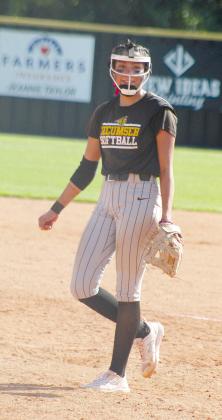 Tecumseh senior Serenity Jacoway smiles after a successful pitch in the fourth inning of Class 4A Regional Tournament game with Broken Bow.