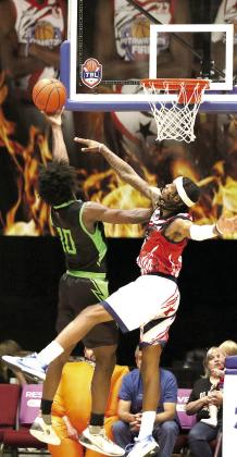Potawatomi Fire Forward Ricky Artis II tries to block a shot by a Little Rock Lightning player during the May 9 home game. Artis contributed 20 points, six rebounds, four assists and two steals that night, according to www.potawatomifire.com. Photo courtesy of Kent Bush, CPN