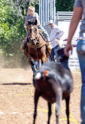 At age 6, Ransom Parsons of Earlsboro participates in the Goat Undecorating event of a COJRA rodeo in Perry, OK. Photo provided.
