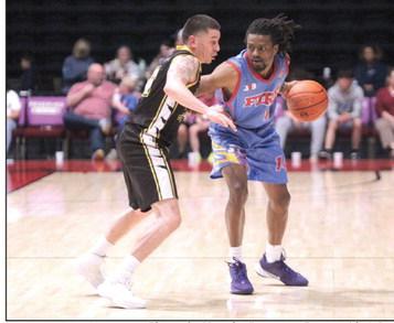 Potawatomi Fire Guard Jahmal McMurray protects the ball and looks to pass in the third quarter of the March 28 home game. Photos by Natasha Dunagan, Countywide &amp;amp; Sun