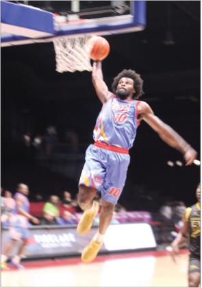 Potawatomi Fire Forward Jeremiah Gilliam makes a steal and a slam dunk in the fourth quarter of the March 28 home game.