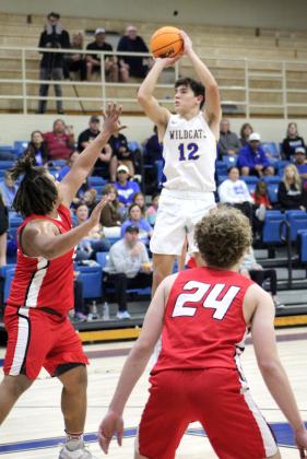 Bethel’s John Gordon sinks a shot during the Dec. 9 game against McLoud in the first round of the First United Bank Classic in Bethel. The Wildcats won 58-37 but went on to lose to Clinton, 47-51, on Dec. 10, and Perkins-Tryon, 35-56, Dec. 11. Out of eight schools, the Prague boys came out on top. Countywide &amp;amp; Sun/Natasha Dunagan