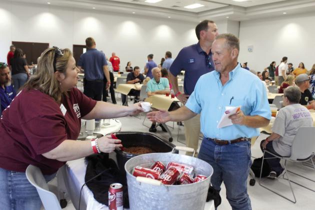 Rose Rock Habitat for Humanity Community Engagement Coordinator April Grant hands a bowl of chili to State Representative Danny Sterling, who was a judge during the Second Annual United Way Kickoff Cookoff, held at the Gordon Cooper Technology Center Safety Center on Aug. 27. There were 21 entries from nonprofits, businesses and churches in the event, said United Way of Eastern Frontier Country Executive Director Sandy Vanderburg. Countywide &amp; Sun/Natasha Dunagan