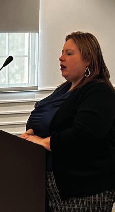 April Grant addresses the County Commissioners regarding the request to reallocate funds previously awarded to Rose Rock Habitat for Humanity. Suzie Campbell, Countywide &amp; Sun