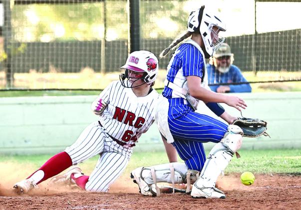 NRC's Ashlyn Bade beat the throw at home for the score.
