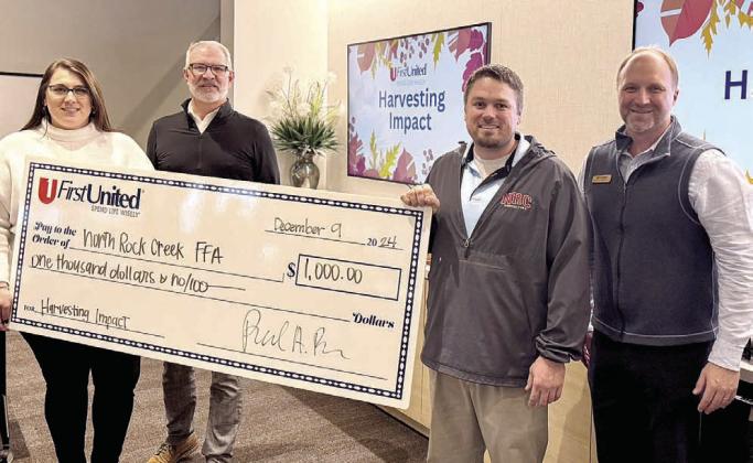North Rock Creek FFA Advisor Josh Davis, third from left, accepts a check for $1,000 from representatives of First United Bank in Shawnee after winning the first FUB Harvesting Impact contest on Dec. 9, 2024. Also shown from left are Mackenzie Collopy, Loan Officer; Paul Bass, retired Community Bank President; and Brock Fletcher, Community Bank President. Photo provided.