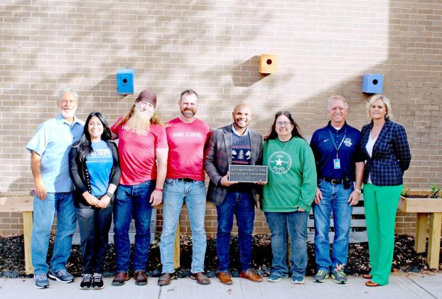 Representatives from Blue Zones Project, Community Renewal and Shawnee Public Schools pose in the “Calming Space” at Shawnee High School, a fenced area where students in the special education class can learn about science, play games, read, and hold conversations. Shown, from left, are Dr. Stephen Trotter, Suhaila Nease, Travis Flood, Brandon Dyer, John Bobb-Semple, Theresa Dame, Ray Shaffer, and Dr. April Grace. Countywide &amp;amp; Sun/Natasha Dunagan