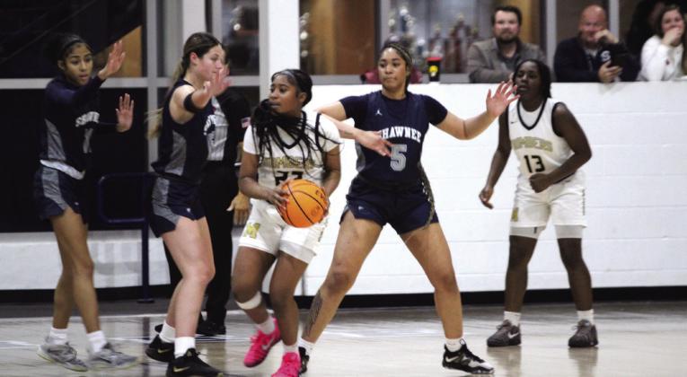 Three Lady Wolves guard the basket in the Jan. 22 game against Midwest City during the Shawnee Invitational. Natasha Dunagan, Countywide &amp;amp; Sun