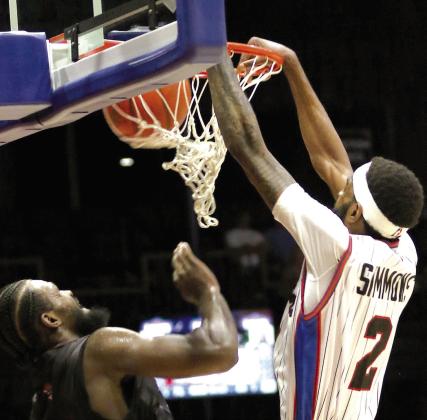 Potawatomi Fire Forward Jachai Simmons makes a slam dunk during the Central Conference Finals on June 8. Photo courtesy of Kent Bush.