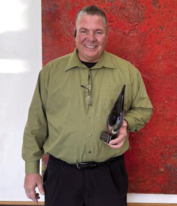 Tecumseh Band Director John Outon was named the East Central Oklahoma Band Directors' Association Band Director of the Year on Jan. 10, after being chosen by 32 of his colleagues. Outon is shown with his award. Photo provided