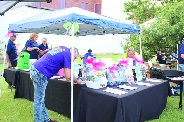 Rose Rock Habitat for Humanity offered a silent auction as part of their Hope on the Horizon Benefit Concert, held at Main and Broadway streets in Shawnee on July 21. There was a street fair which featured inflatables, food trucks, 12 vendors, four bands who played outside, and a VIP concert inside at the Ritz featured three musical acts and a comedian.