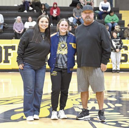 Tecumseh senior Cadence Leba received her All-State Fast Pitch jacket during halftime of the Savages' home game on Jan. 13. Shown, from left, are Fast Pitch Assistant Coach Aspen Grimes, Leba and Fast Pitch Assistant Coach Perry Wilson. Photo courtesy of Kenetta Lisenbee