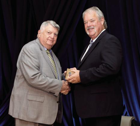 Dr. Phil Berkenbile presents award to Randy Gilbert at the Career Tech Hall of Fame event held Oct. 3. Photo provided