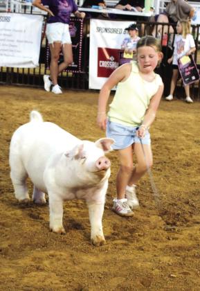 Jadee Davis of Tecumseh exhibits her Chester pig.