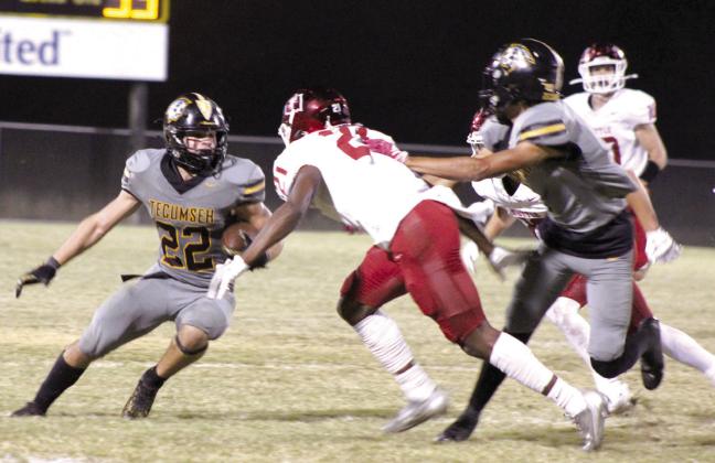Tecumseh senior Maddox Anderson dodges a Tuttle defender while carrying the ball in the third quarter of the home game, Oct. 20. The Savages lost, 6-50. Countywide &amp;amp; Sun/Natasha Dunagan