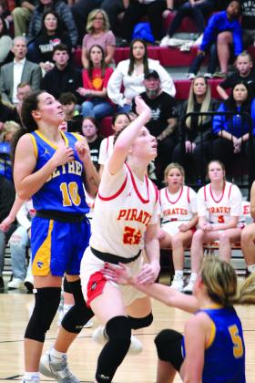 Bethel’s Parker Stevenson (#10) reacts to a shot put up by Dale’s Brook Rutland in the fourth quarter of the game at Dale on Dec. 2.. Also shown is Bethel’s Brooklyn Duff who was knocked down defending the basket.