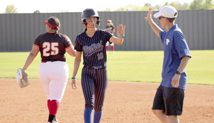 Bethel junior Layla Menhusen gets a high-five from Assistant Coach Tara Satterfield after hitting a single during the game against Dale at Shawnee on April 15. During the triple header, the Lady Wildcats lost to the Lady Pirates, 7-9, and won with the Lady Wolves, 14-0. Natasha Dunagan, Countywide &amp; Sun