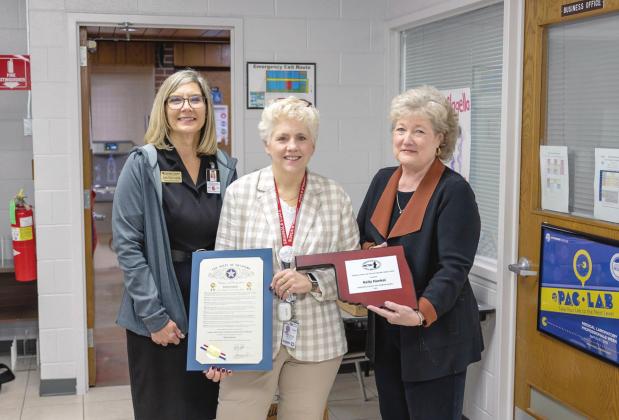 Gordon Cooper Technology Center Superintendent Julie McCormick (left) and Seminole State College President Lana Reynolds (right) congratulate MLT Program Director Kelly Hankal (center) on her Outstanding Instructor award. Photo provided