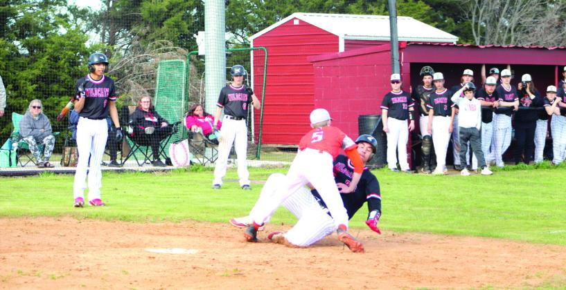 Earlsboro senior Rodney Stryker is tagged as he slides into home in the first inning of the home game with Strother, March 27. Countywide &amp;amp; Sun/Natasha Dunagan
