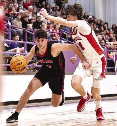 Devon Haney drives around a Stilwell defender. NRC Cougars claimed the regional championship, beating Stilwell 63-49. The Cougars will play Newcastle Friday in Area, in Okmulgee.