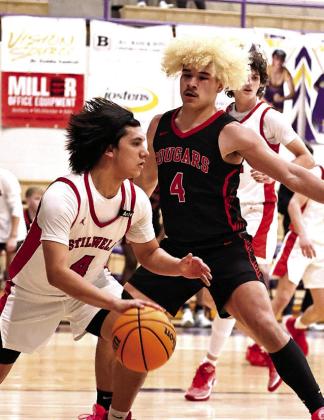 JJ McClain puts pressure on the Stillwell player during regional play last week.