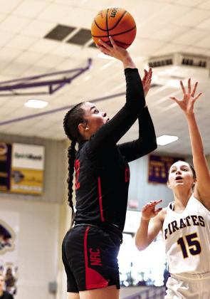 Sarah Campbell shoots for two in regional play last week. The Lady Cougars ended their season with a loss against Bristow.