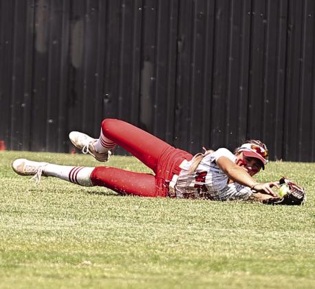 North Rock Creek’s Aubree Shivelhood makes a diving catch for the out at the Class 4A Super Regionals against Elk City on Oct. 10. Photo courtesy of Gowin Photography