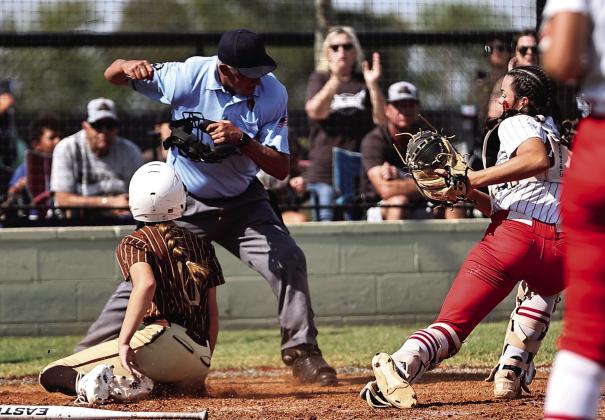 North Rock Creek’s Sarah Campbell tags the Elk City runner for the out in action during Super Regionals on Oct. 10. The Lady Cougars lost two games with Elk City, 3-4 &amp; 1-7, to end their season with a record of 31-8. Photo courtesy of Gowin Photography