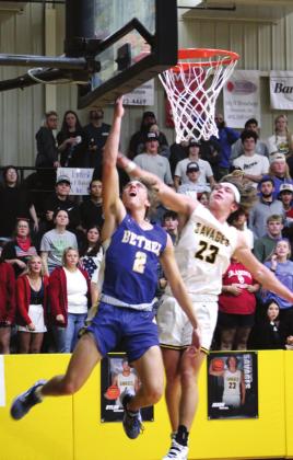 Bethel’s Xavier Meier makes two points after stealing the ball as Tecumseh’s Jaxon Meyers blocks during the Tecumseh home game on Dec. 3. Bethel won 77-56. Countywide &amp;amp; Sun/Natasha Dunagan