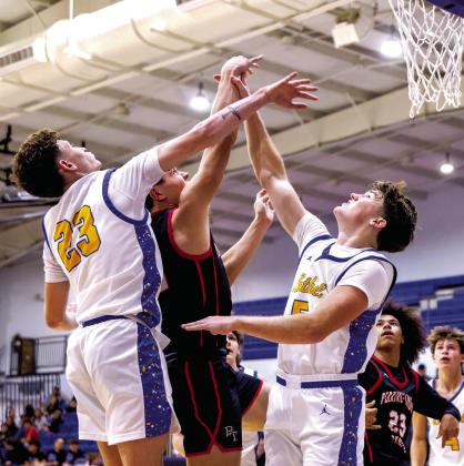 Bethel seniors Darius Cheatham and Zack Jennings defend the bucket during the Dec. 11 game against Perkins-Tryon in the Bethel First United Basketball Classic. The Wildcats lost that game, 52-67, and a close game against Sallisaw, 62-65, before winning with Pauls Valley, 53-48. Photo courtesy of Richelle Treece