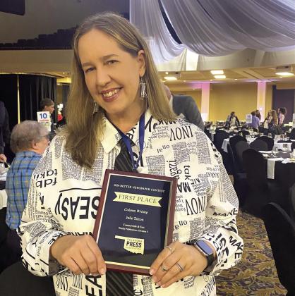 Julie Talton won first place in Division 5 for column writing at the OPA Awards Convention held last weekend. She's posing with her plaque and wearing custom earrings made with film left over from rolls she used taking pictures for the Countywide in the early 90s! 'I absolutely love writing a monthly column ... and knowing that someone else actually enjoys reading it is mind blowing to me!' Natasha Dunagan, Countywide &amp; Sun