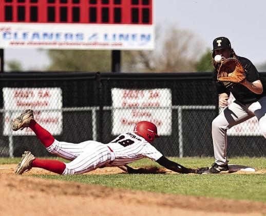 North Rock Creek’s Hunter Bertram made it safely back to first base. Photo courtesy of Gowin Photogeraphy