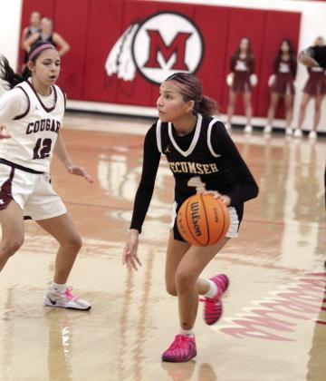 Tecumseh junior Livia FourHorns looks for an opening to pass in the fourth quarter of the Class 4A Regional Consolation Bracket game against Ada, held at McLoud on Feb. 26. The Lady Savages lost, 32-42, ending their season. Photos by Natasha Dunagan, Countywide &amp; Sun