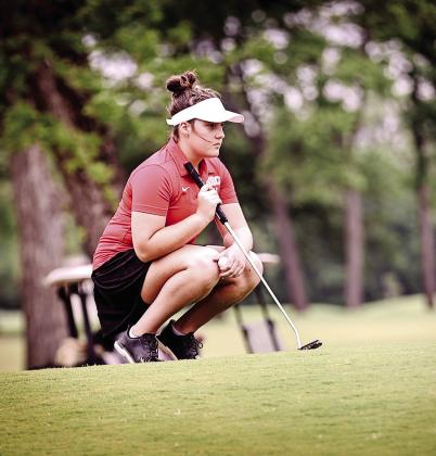 Junior Robyn Click looks at the green on the 17th hole of FireLake Golf Course on April 14.