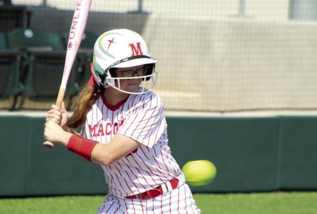 Macomb sophomore Lacie Lackey passes on a ball, resulting in a walk.