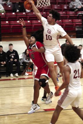 Earlsboro’s Elias Barrazza goes in for a basket, but is fouled in the game with Wynnewood, Jan. 5, during the Jim Walling Classic. The Wildcats lost this game, 46-51, but won their next two games with Olive, 63-46, and Wilson (Henryetta), 67-46, to become the Consolation Champions.