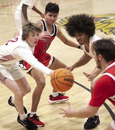 The ball is temporarily up for grabs in the game between Earlsboro and Wynnewood, Jan. 5, during the Jim Walling Classic.