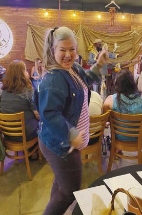 Kim Elliott strikes a pose for the judges in her purple outfit and unicorn puff-painted jean jacket. Elliott was styled by Keith Hall for the event.