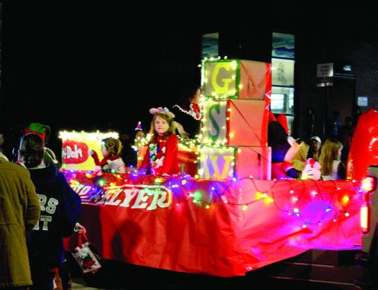 Girl Scout Troop #240 rides on their float in the Shawnee Christmas Parade on Dec. 8. There were 80 parade entries this year, and the theme was "Christmas in Toyland." Countywide &amp; Sun/Natasha Dunagan