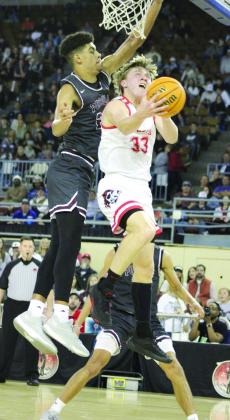 Dale senior Dayton Forsythe goes up for a shot but is blocked by a Pocola player during the Class 2A State Tournament Finals, held at the State Fair Arena on March 9. Teammate Jett Higdon got the rebound. The Pirates are State Champs for the third year in a row. They beat Warner, 87-50; Hennessey, 67-44; and Pocola, 63-38, and they end the season with a record of 30-2. Countywide &amp; Sun/Natasha Dunagan