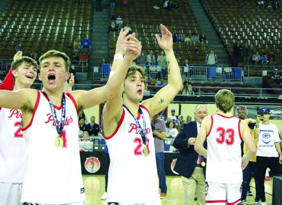 Dale’s Tray Chambers, Jett Higdon and Deken Jones rally the crowd as senior Dayton Forsythe gets his medal after the Pirates won the Class 2A State Basketball Tournament Finals on March 9. Countywide &amp; Sun/Natasha Dunagan