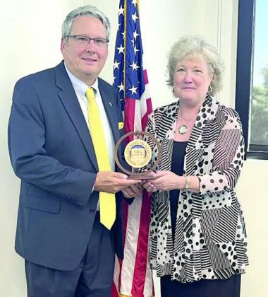 Reynolds Recognized for Service to the Council of Presidents Seminole State College President Lana Reynolds (right) was recognized by the Oklahoma State Regents for Higher Education last week for her service as Chair of the Council of Presidents for 2023-2024. At the June meeting of the COP, Reynolds was presented an engraved wooden medallion marking her tenure as Chair by Vice Chair Dr. Thomas Newsom (left), President of Southeastern Oklahoma State University. Photo provided by SSC