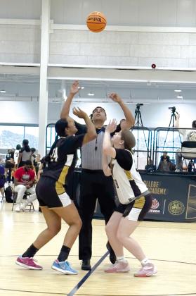 Tecumseh High School senior Reagan Berry, right, tips off during the NCAA Women’s College Basketball Academy in Memphis, TN, last month. Photo provided.