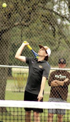 Tecumseh senior Eli Mullins serves on the #1 Doubles team, with fellow senior Xzavier Kommer, during the Tecumseh Tennis Tournament on March 31.