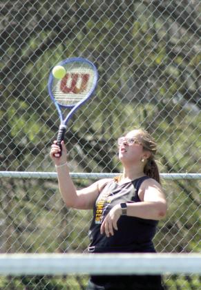 Tecumseh junior Hannah Tidwell makes a hit during the Tecumseh Tennis Tournament on March 30. Tidwell and her partner on #2 Doubles, Savannah Wootten, also a junior, placed second, and the #1 Doubles team of Kalyn Bartmess and Maggie Johnson placed fourth. The Lady Savages tennis team placed first.
