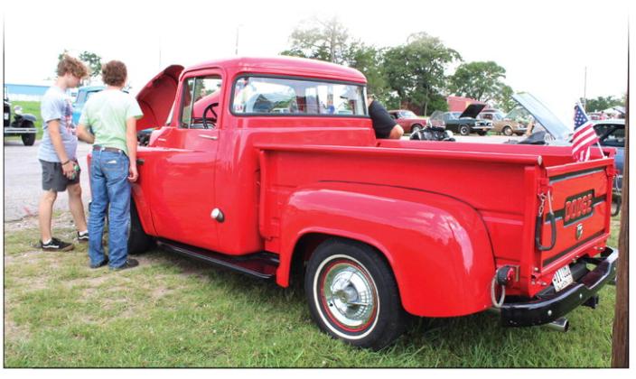 Two teens look over a 1956 Dodge C-3B during a car show held in Macomb on June 23. The car show was part of Macomb’s 21st Century Summer School Program, with a “Time Travel Summer” theme. This was 1950s week, said program director Shannon Browning, who added that they would also have a sock hop that day. They have also been to medieval, colonial and the 1980s, and will travel to the Wild West next. There were 26 cars in the show, which was organized by Andy Reich of Romulus Baptist Church.
