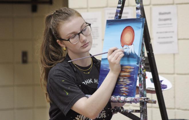 Jordyn Wiley, from Pinot’s Palette in Norman, demonstrates how to paint snow on a mountain for a class of about 16 people on June 25. The painting class was held at the Tecumseh City Hall Auditorium as a program of the Tecumseh Pioneer Library Systems Summer Learning Challenge. The next “Painting Together - Step By Step” class will be for teens ages 12-17 on July 10 at 2 pm. For more information, visit https://pioneer.libnet.info/events?r=thismonth. Countywide &amp;amp; Sun/Natasha Dunagan